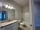 Clean bathroom featuring a vanity with a granite countertop, a shower-tub combo and recessed lighting at 4477 Sw 90Th Pl, Ocala, FL 34476