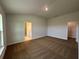 Spacious bedroom with neutral carpet, multiple doorways, and excellent natural light at 4477 Sw 90Th Pl, Ocala, FL 34476