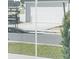 View of the garage and driveway from inside the home at 7772 Sw 56Th Pl, Ocala, FL 34474