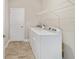 Laundry room with washer, dryer, and shelving at 7772 Sw 56Th Pl, Ocala, FL 34474