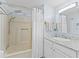 Clean bathroom with shower and tub, bright lighting, and a modern vanity at 816 Hibiscus Dr, The Villages, FL 32159