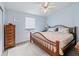 Bright bedroom with a large window, closet space, and stylish decor at 816 Hibiscus Dr, The Villages, FL 32159