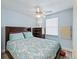 Bedroom with queen bed, ceiling fan and dresser at 816 Hibiscus Dr, The Villages, FL 32159