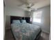 Bedroom with a queen bed and ceiling fan at 816 Hibiscus Dr, The Villages, FL 32159