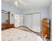 Inviting bedroom with a spacious closet, a vanity area, and an ensuite bathroom at 816 Hibiscus Dr, The Villages, FL 32159