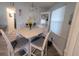 Inviting dining area with white table and chairs, and lots of natural light at 816 Hibiscus Dr, The Villages, FL 32159