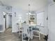 Bright dining area with white table and chairs at 816 Hibiscus Dr, The Villages, FL 32159