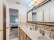 Double vanity bathroom with access to bedroom at 8955 Sw 104Th Pl, Ocala, FL 34481