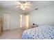 Bedroom with ceiling fan, double closet and bathroom access at 8955 Sw 104Th Pl, Ocala, FL 34481