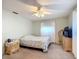 Bright bedroom with ceiling fan and double dresser at 8955 Sw 104Th Pl, Ocala, FL 34481