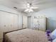 Bedroom with ceiling fan and large wardrobe at 8955 Sw 104Th Pl, Ocala, FL 34481