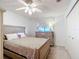 Bedroom with ceiling fan and chest of drawers at 8955 Sw 104Th Pl, Ocala, FL 34481