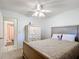 Bedroom with ceiling fan and built-in wardrobe at 8955 Sw 104Th Pl, Ocala, FL 34481