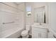 Bathroom with a bathtub, toilet, and vanity with white cabinets at 10218 Sw 99Th Ln, Ocala, FL 34481