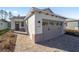 Craftsman style home with gray garage door and paver driveway at 10218 Sw 99Th Ln, Ocala, FL 34481