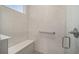 Walk-in shower with built-in seat and glass enclosure at 10218 Sw 99Th Ln, Ocala, FL 34481