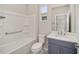 Bathroom features a shower/tub combo, vanity, and toilet at 10282 Sw 99Th Ln, Ocala, FL 34481