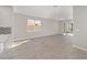 Sunlit living room with tile flooring and access to a screened patio at 10282 Sw 99Th Ln, Ocala, FL 34481