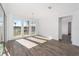 Bright dining room with wood-look floors and large windows at 10832 Sw 101St Loop, Ocala, FL 34481