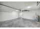 Spacious garage with concrete floor and overhead storage at 14366 Se 27Th Ct, Summerfield, FL 34491