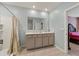 Clean bathroom with double vanity and tub shower combo at 451 Hickory Course Loop, Ocala, FL 34472