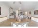 Kitchen and dining area with light wood table and grey cabinets at 451 Hickory Course Loop, Ocala, FL 34472