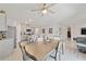 Dining area with a large table and view into the kitchen at 451 Hickory Course Loop, Ocala, FL 34472