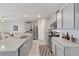 Modern kitchen with gray cabinets, granite countertops and stainless steel appliances at 451 Hickory Course Loop, Ocala, FL 34472