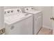 Laundry room with a white washer and dryer set at 451 Hickory Course Loop, Ocala, FL 34472