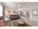 Living room with leather couches, coffee table, and open floor plan at 451 Hickory Course Loop, Ocala, FL 34472