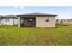 Backyard view of house with screened porch at 5779 Sw 87Th Court Rd, Ocala, FL 34481