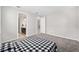 Bedroom with gray carpet, en-suite bathroom, and access to a hallway at 5779 Sw 87Th Court Rd, Ocala, FL 34481