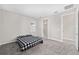 Bright bedroom with gray carpeting and en-suite bathroom access at 5779 Sw 87Th Court Rd, Ocala, FL 34481