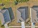 Aerial view of three houses with gray roofs at 6365 Sw 88Th Loop, Ocala, FL 34476