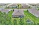Aerial backyard of the home featuring a sunroom overlooking the well manicured green space at 6365 Sw 88Th Loop, Ocala, FL 34476