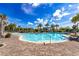 Kidney-shaped pool with brick pavers and shade structures at 6365 Sw 88Th Loop, Ocala, FL 34476