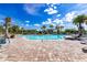 Resort-style pool with lounge chairs and shaded areas at 6365 Sw 88Th Loop, Ocala, FL 34476