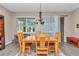 Bright dining room with a wood table and chairs at 6365 Sw 88Th Loop, Ocala, FL 34476