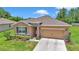 Attractive single-Gathering home with stone accents, a two-car garage, and lush landscaping at 6365 Sw 88Th Loop, Ocala, FL 34476
