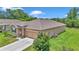 Well-manicured front lawn and landscaping of this lovely single Gathering home with a two-car garage at 6365 Sw 88Th Loop, Ocala, FL 34476