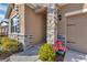 Stone entryway with a covered porch and landscaping at 6365 Sw 88Th Loop, Ocala, FL 34476