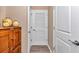 Home hallway with linen closet and wood flooring at 6365 Sw 88Th Loop, Ocala, FL 34476