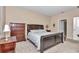 Spacious main bedroom with plush carpeting and large dresser at 6365 Sw 88Th Loop, Ocala, FL 34476