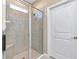 Spacious shower with tiled walls and built-in seat at 6365 Sw 88Th Loop, Ocala, FL 34476