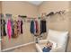 Large walk-in closet with ample shelving and seating at 6365 Sw 88Th Loop, Ocala, FL 34476