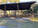 Open barn structure with sturdy posts and a metal roof, ideal for outdoor storage and equipment at 11064 Ne 212Th Ln, Fort Mc Coy, FL 32134