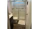 Simple bathroom with a sliding glass shower door, toilet, and vanity, creating a functional space at 11064 Ne 212Th Ln, Fort Mc Coy, FL 32134