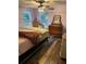 Spacious bedroom with large windows and wood-look flooring at 11064 Ne 212Th Ln, Fort Mc Coy, FL 32134