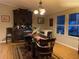 Traditional dining room with antique furniture, creating a vintage and charming dining space at 11064 Ne 212Th Ln, Fort Mc Coy, FL 32134