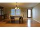 Dining room with wood floors, table with chairs, and a hutch at 11064 Ne 212Th Ln, Fort Mc Coy, FL 32134